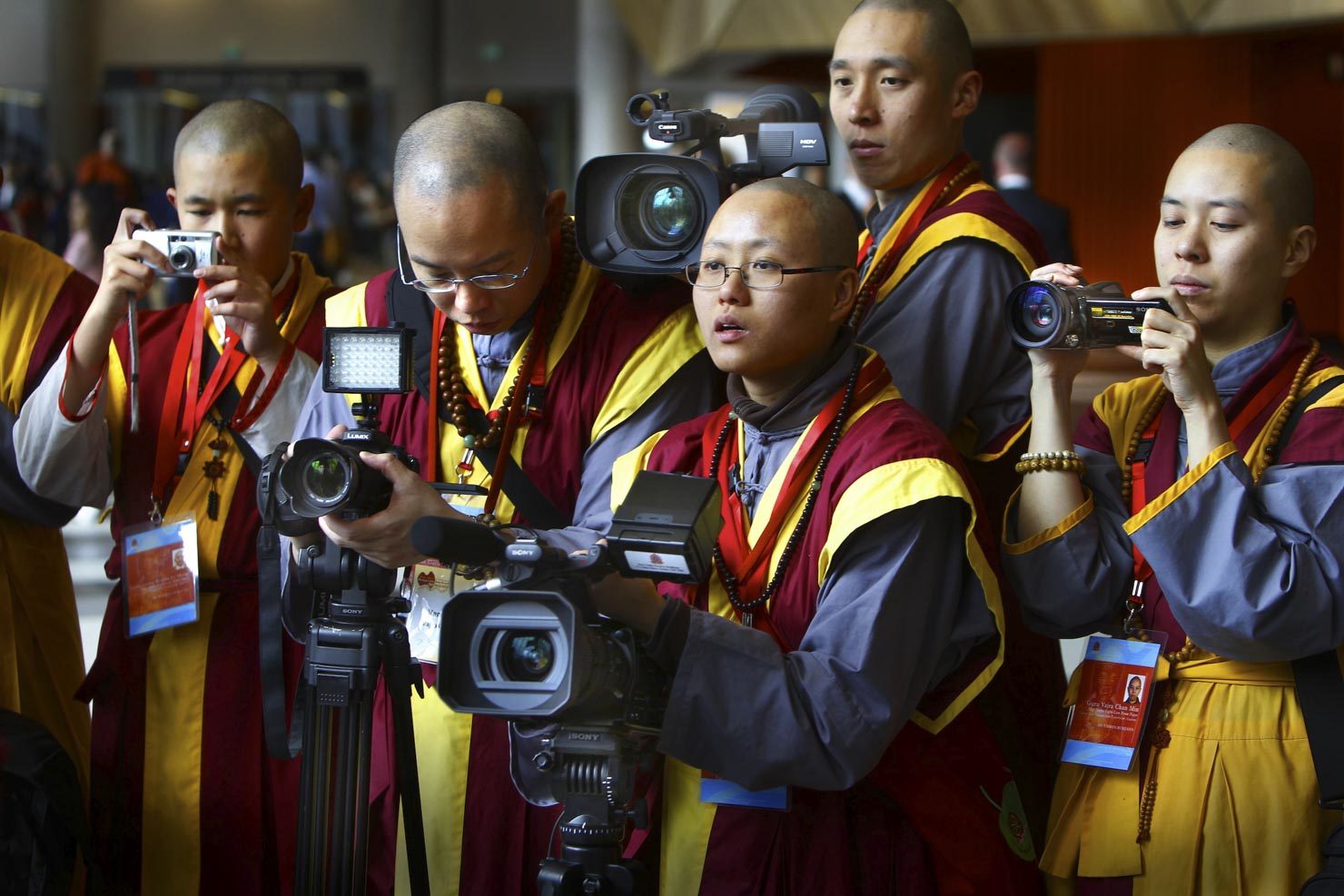 Han Chinese budhist media taking photos & video