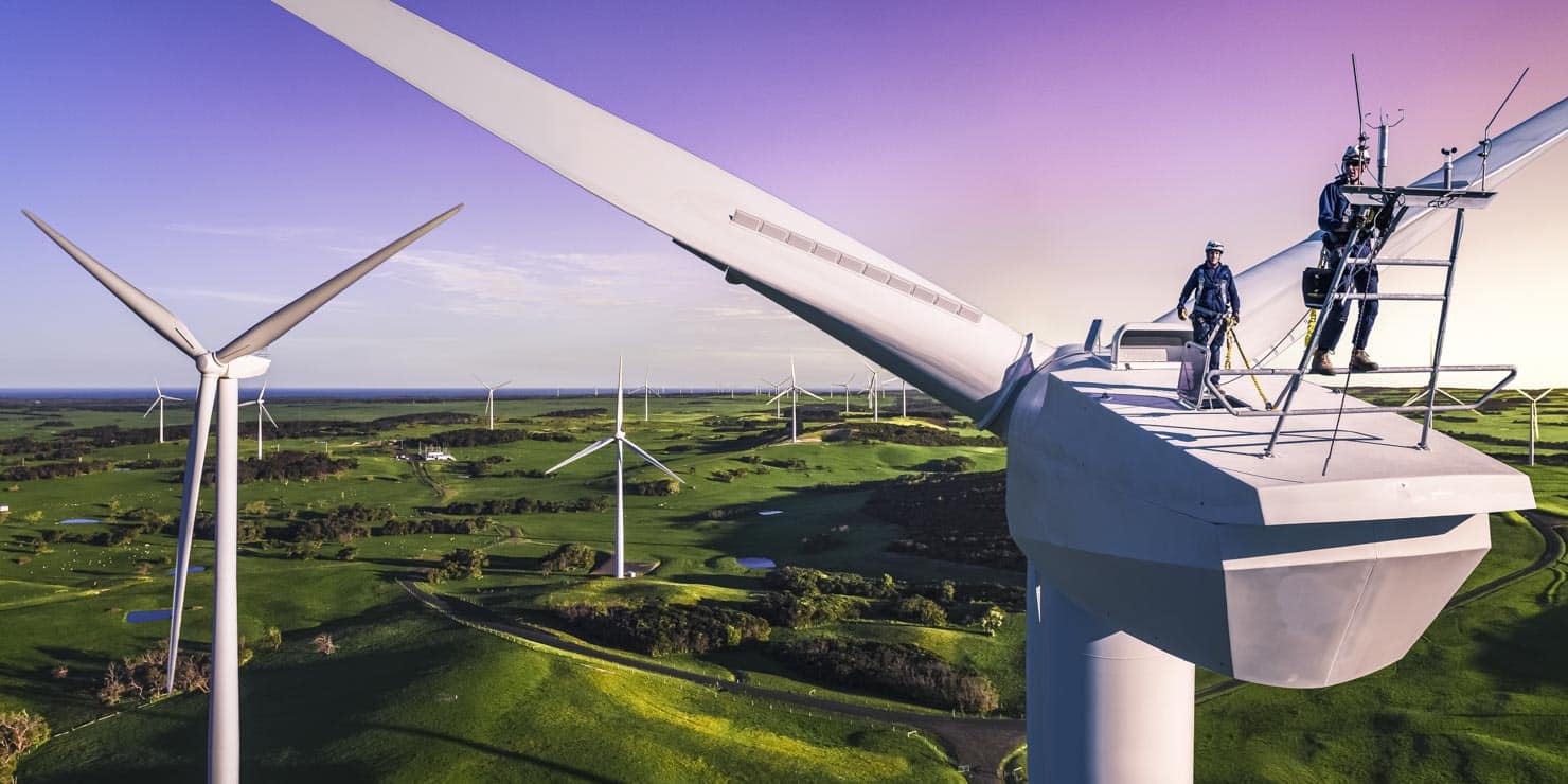 Workers on top of a wind turbine