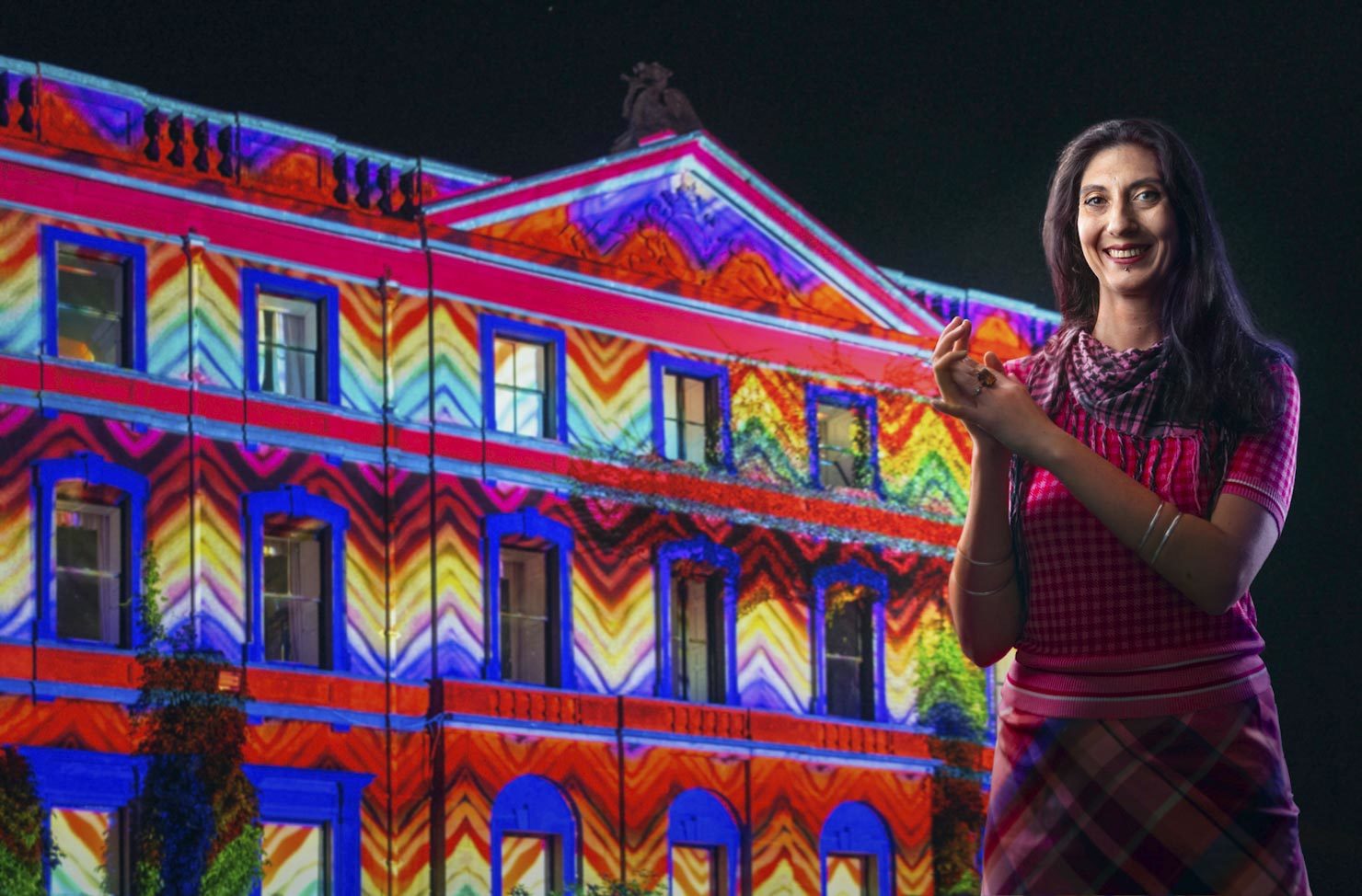 Projectionist with building & projected colours