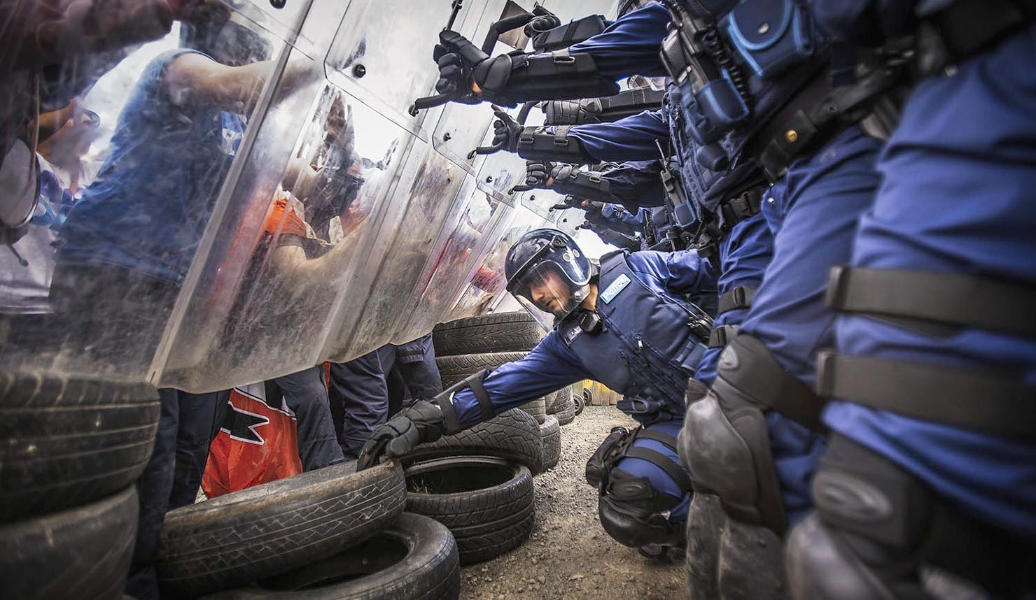 Police crowd control pushing back protesters