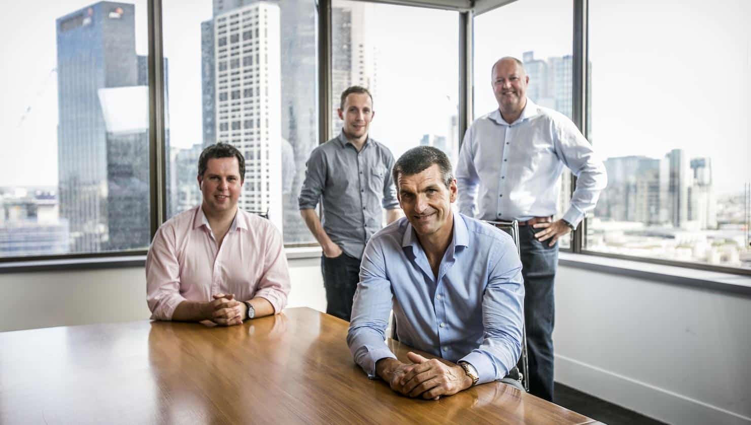 Businessmen with city backdrop