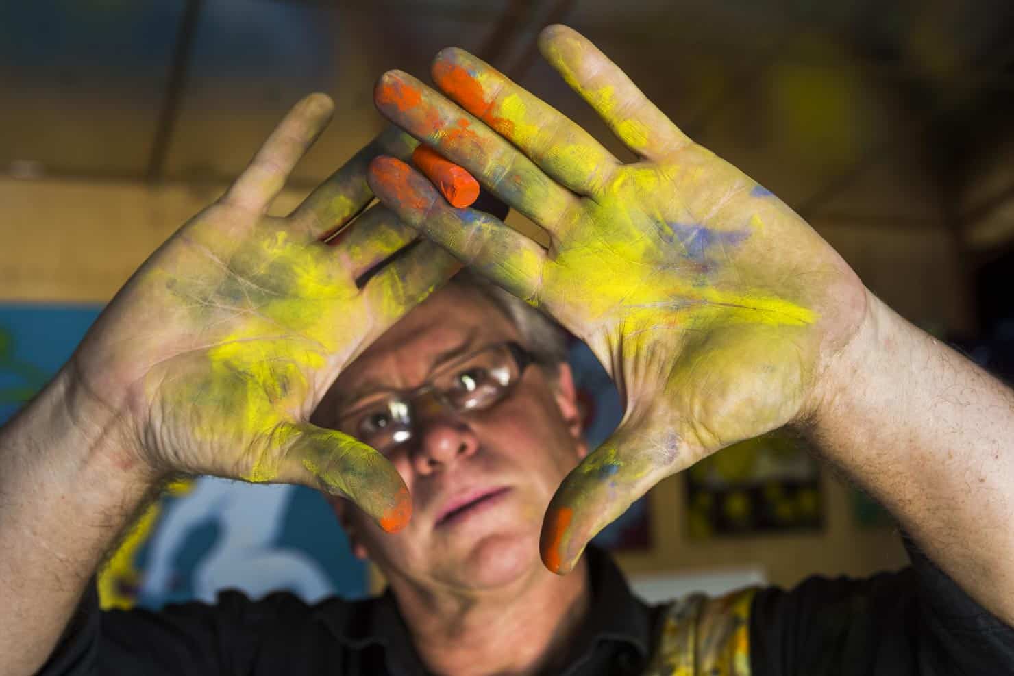 Artist Richard Payne with pastel on his hands
