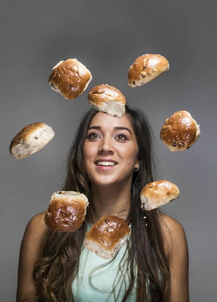 Lady juggling bread buns