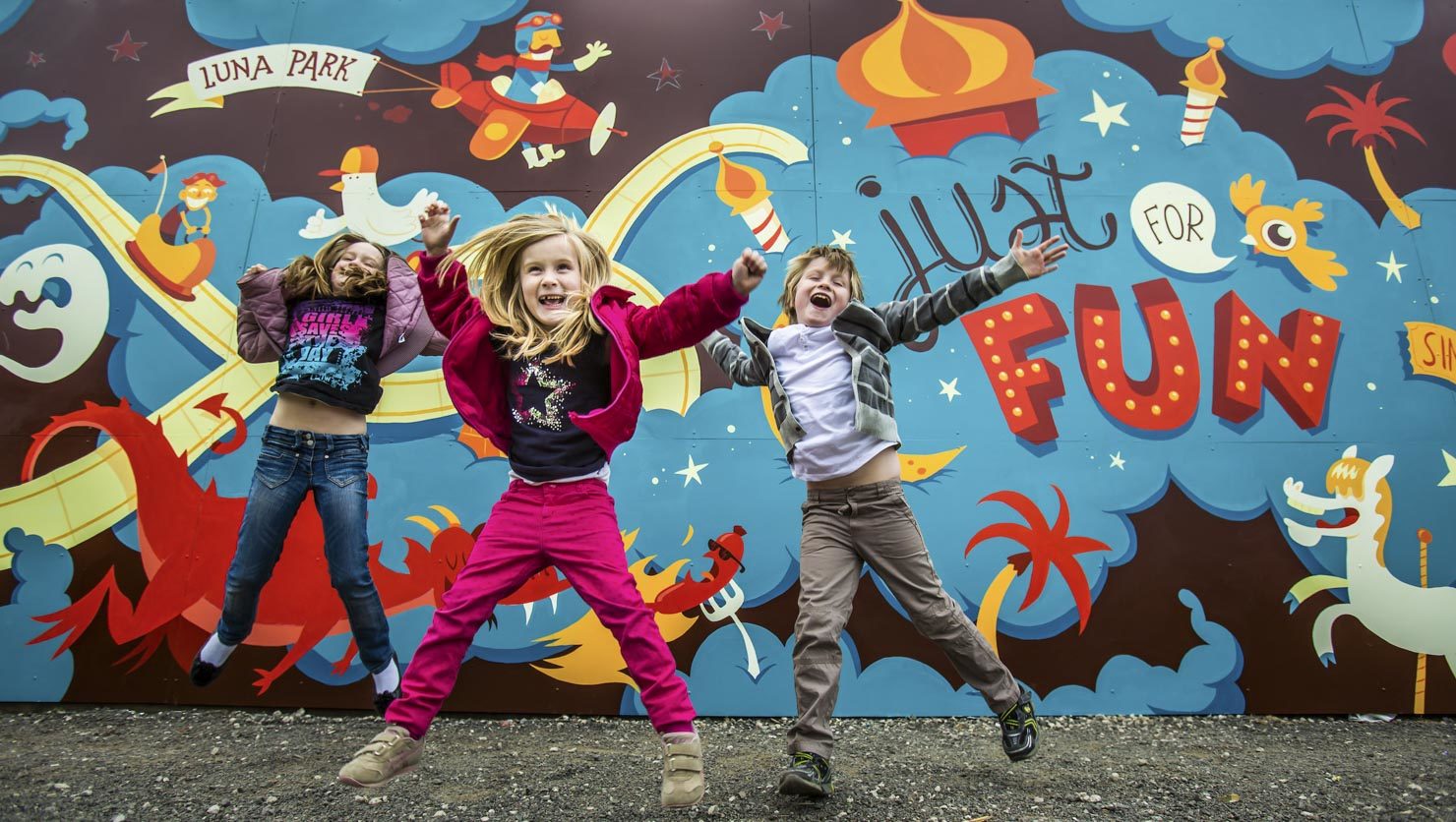 Kids jumping for joy at Luna Park