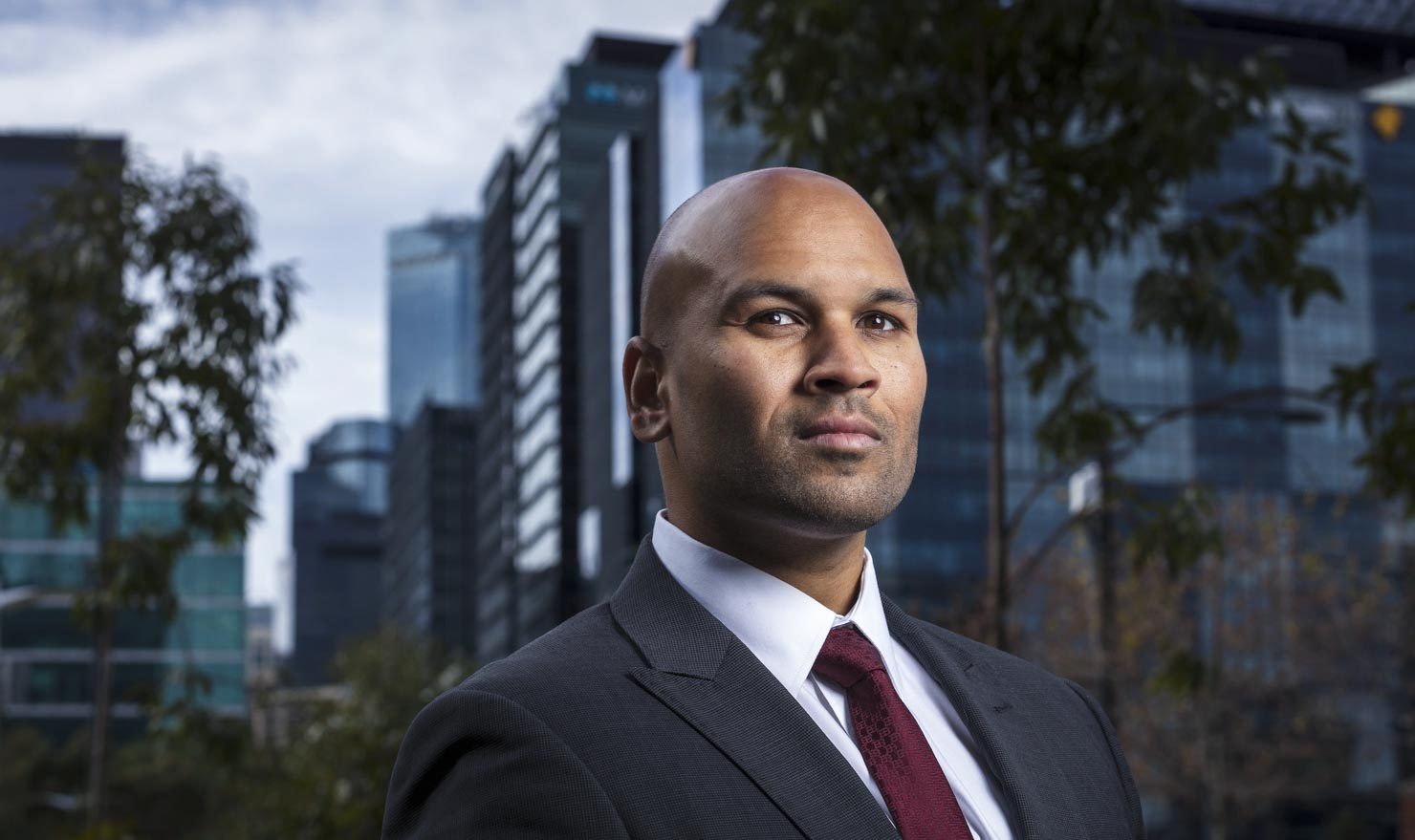 Businessman with tie in front of buildings