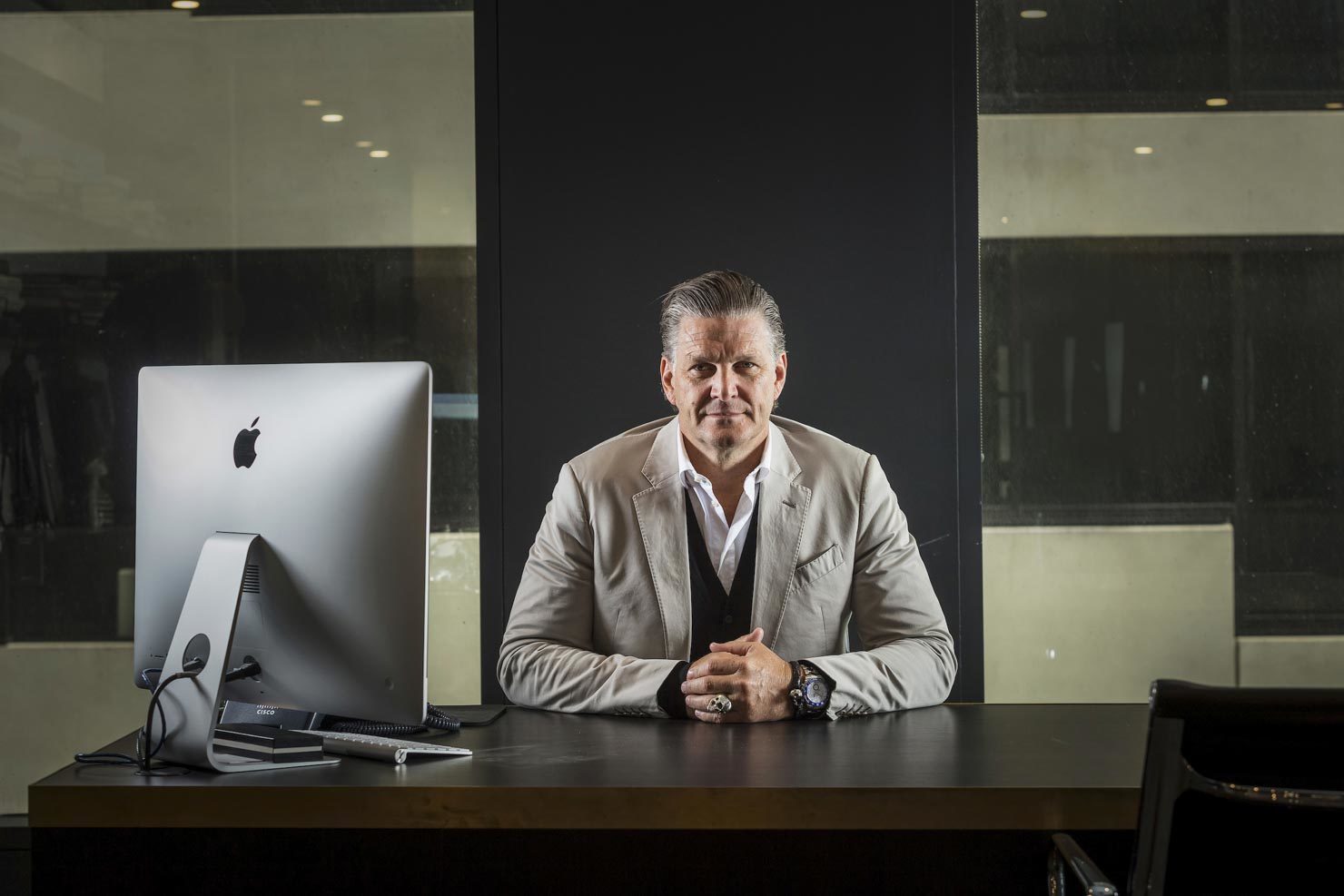 Executive at his desk with dramatic lighting